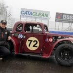 Stuart Gray, Chair of Knockhill Motor Sports Club, on track next to a Scottish Legends Championship car.